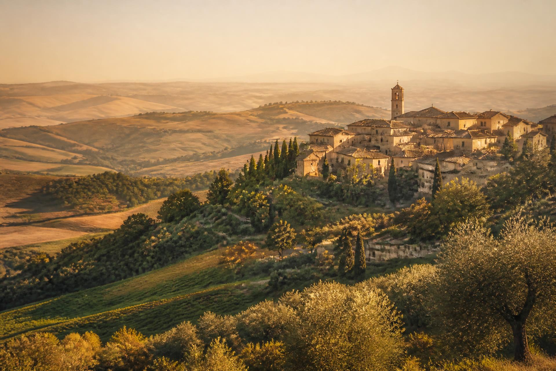 Evening light over a hilltop village in the Marche countryside